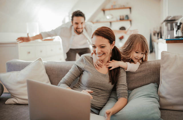 family playing using laptop