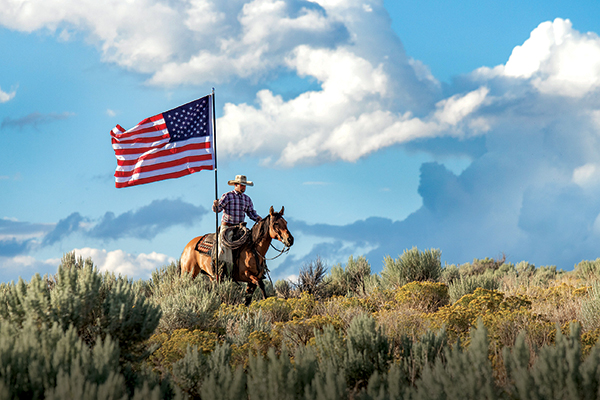 photocontest2024-cowboy riding with American flag