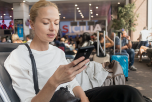 woman on cell phone at airport